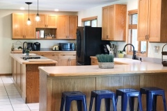 Kitchen with peninsula and bar stools